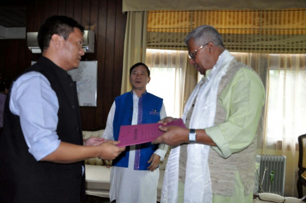 Pema Khandu the new leader of the Congress Legislature Party in Arunachal Pradesh handing over letters of support from his MLAs to Governor Tathagata Roy