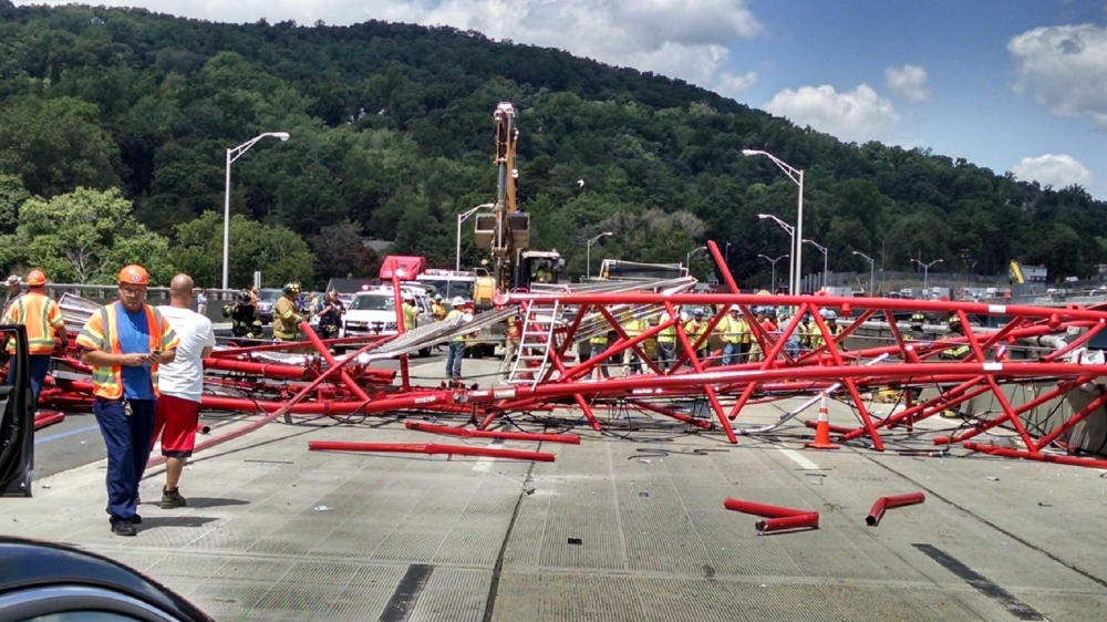 A giant crane sits on the roadbed of the Tappan Zee Bridge north of New York City after toppling around noon on Tuesday during construction of a new bridge