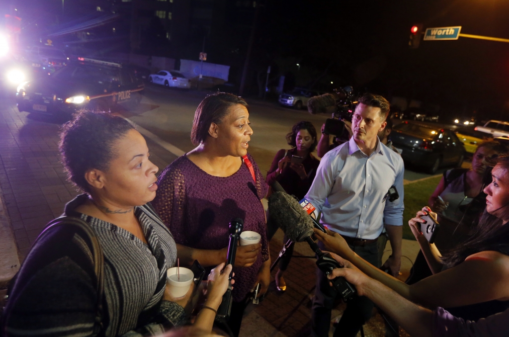 Sherie Williams left and Theresa Williams center speak to the media as they leave the Baylor University Medical Center Friday