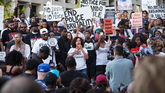 Demonstrators protest against police brutality in a Black Lives Matter rally in Dallas Texas on Thursday