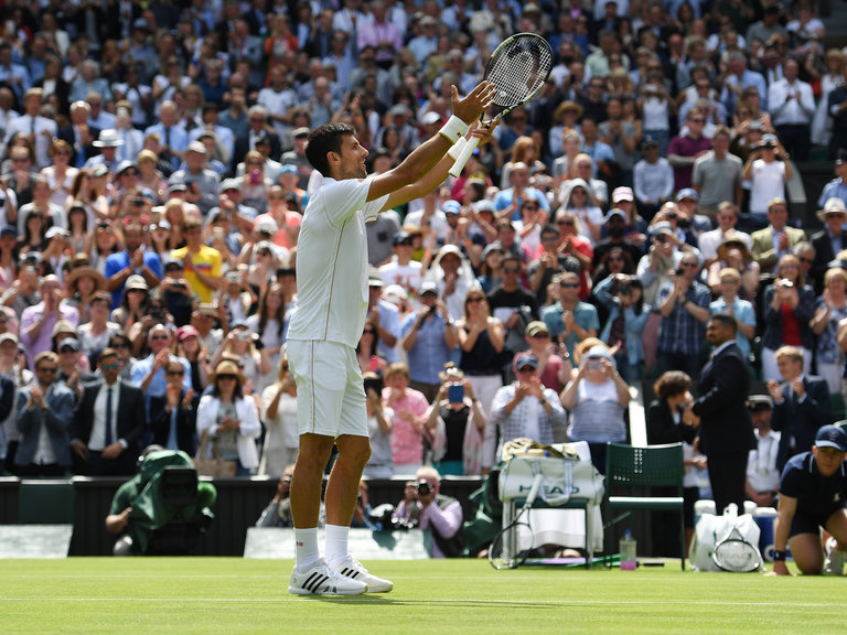 Novak Djokovic applauds the Centre Court crowd after his victory