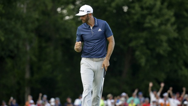 Dustin Johnson celebrates on the 15th hole