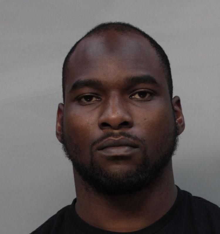 Eagles linebacker Nigel Bradham turned himself into police on Miami Beach after being charged with beating up a worker at t he Hilton Bentley Hotel in Miami Thursday