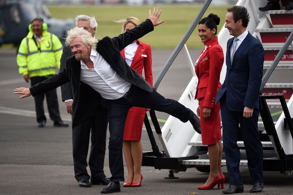 Virgin boss Richard Branson with Virgin Atlantic staff after they arrive aboard a new Airbus A350 at the Farnborough International Airshow in Farnorough south England Monday
