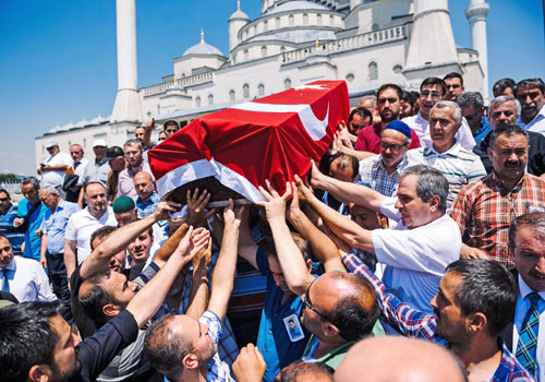 Supporters carry the coffin of Sehidmiz Murat Inci victim of the Turkish coup attempt during his funeral ceremony at Kocatepe Mosque in Ankara on July 18. Turkey has detained 103 generals and admirals as well as more than 2800 soldiers accused of suppor