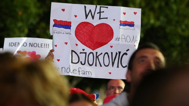 Fans celebrate Novac Djokovic's win over Andy Murray in the men's singles final of the 2016 Australian Open at Melbourne