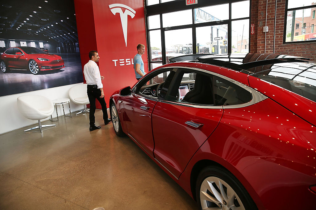 A Tesla model S sits parked in a new Tesla showroom and service center in Red Hook Brooklyn