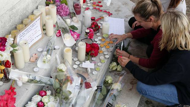 Flowers candles and messages are placed near the home of Father Jacques Hamel in Saint-Etienne-du-Rouvray