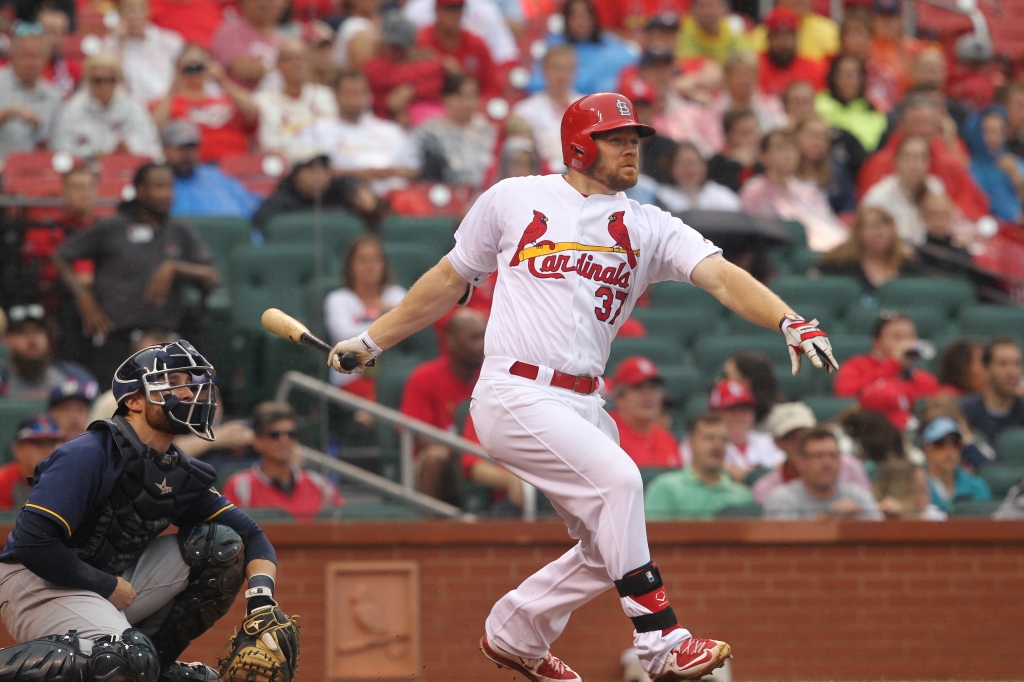 St. Louis Cardinals Brandon Moss swings hitting a RBI triple run in the fifth inning against the Milwaukee Brewers at Busch Stadium in St. Louis