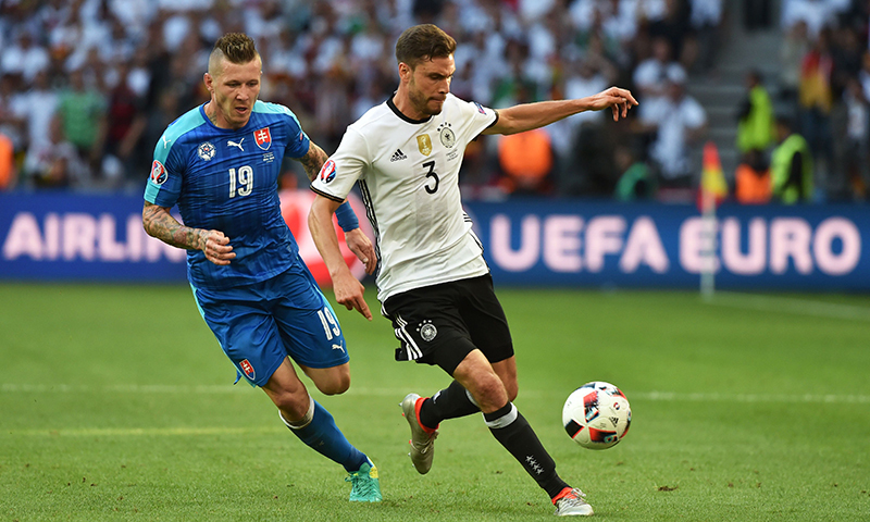 Slovakia's midfielder Juraj Kucka vies with Germany's defender Jonas Hector during the Euro 2016 round of 16 football match between Germany and Slovakia.-AFP