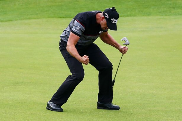 Henrik Stenson celebrates victory after the winning putt