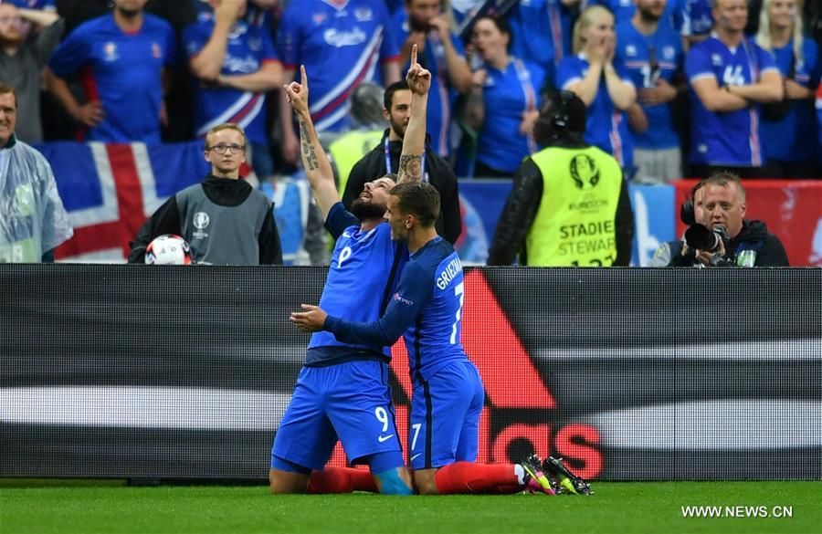 Olivier Giroud of France celebrates scoring during the Euro 2016 quarterfinal match between France and Iceland in Paris France