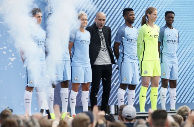 Guardiola being presented to the fans at City Academy Stadium with Kelechi Iheanacho and Steph Houghton. — Reuters  Action Images pics