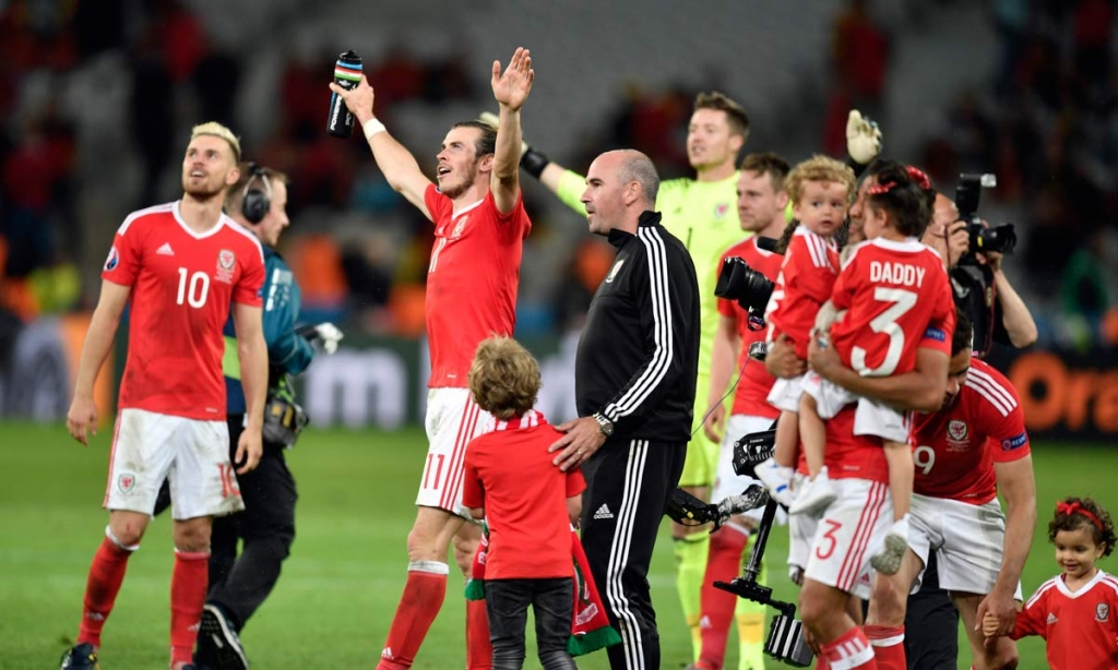 Wales&#039 Gareth Bale center left and his teammates celebrate at the end of the Euro 2016 quarterfinal soccer match between Wales and Belgium at the Pierre Mauroy stadium in Villeneuve d’Ascq near Lille France Friday