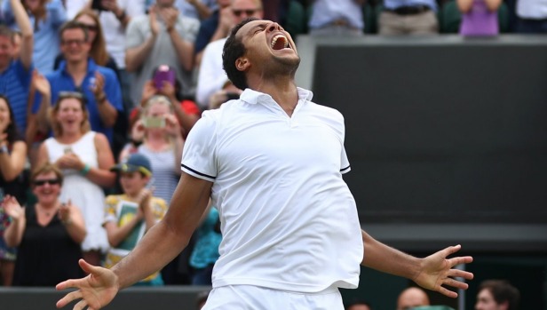 Jo-Wilfried Tsonga celebrates victory over John Isner after their marathon match