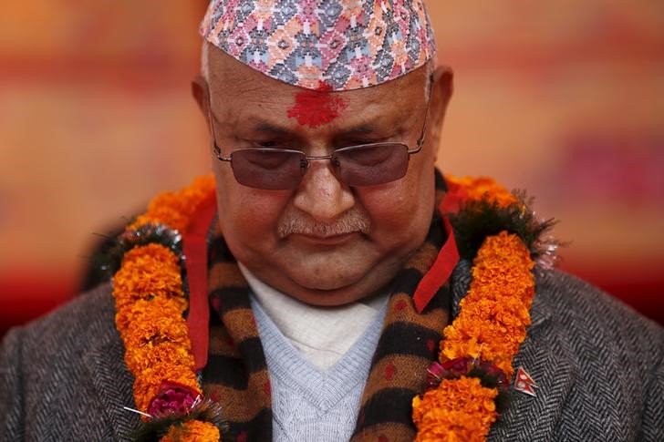 Nepal's Prime Minister Khadga Prasad Sharma Oli also known as KP Oli observes a minute of silence for earthquake victims during an event organised to mark the 18th National Earthquake Safety Day and the official launch of earthquake reconstruction