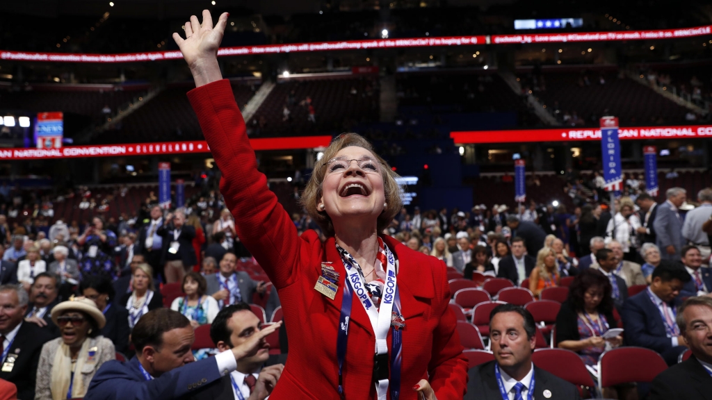 Kansas delegate Beverly Gossage cheers from the floor of the Republican National Convention in Cleveland