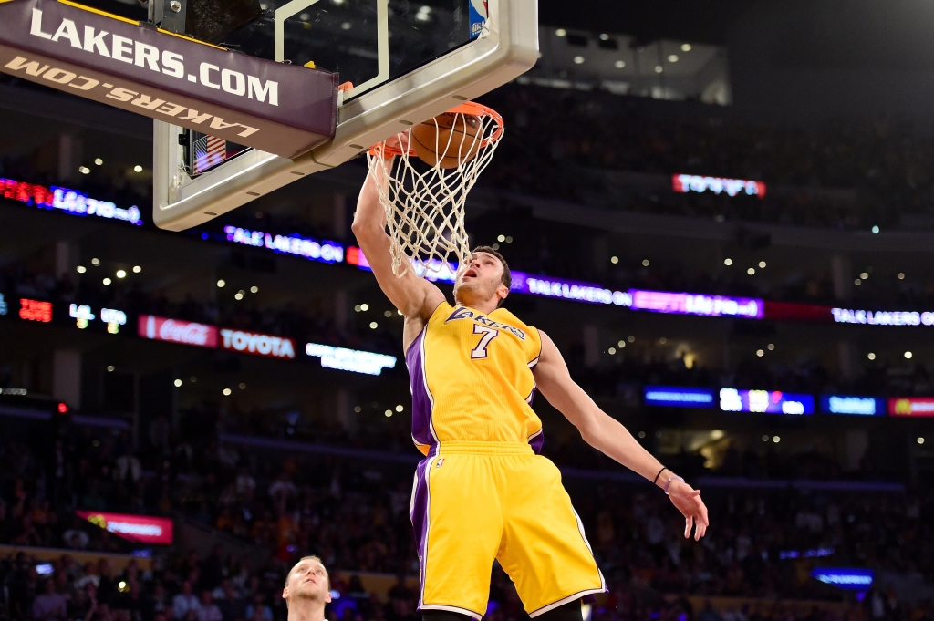 LOS ANGELES CA- APRIL 13 Larry Nance Jr. #7 of the Los Angeles Lakers dunks the ball against the Utah Jazz in the second half at Staples Center