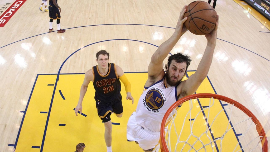 FILE- Warriors center Andrew Bogut dunks against Cavaliers center Timofey Mozgov during the second half of Game 1 of basketballs NBA Finals in Oakland June 4. 2015