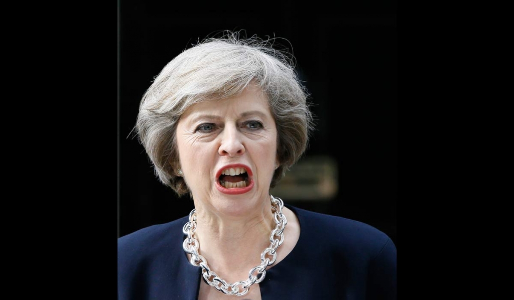 New British Prime Minister Theresa May speaks to the media outside her official residence,10 Downing Street in London Wednesday