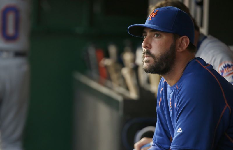 New York Mets starting pitcher Matt Harvey sits in the dugout during a game against the Washington Nationals