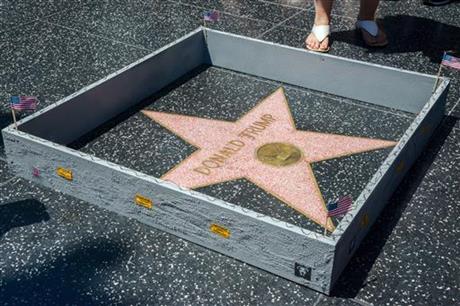 Stern shows a six-inch high concrete-appearing 'wall,&#039 created by an artist known as Plastic Jesus surrounding the Hollywood Walk of Fame star of Donald Trump in Los Angeles. It appeared the