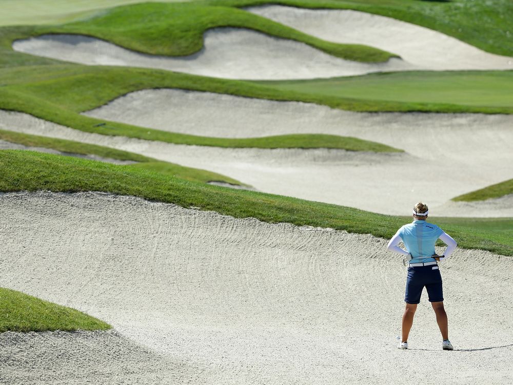 SAN MARTIN CA- JULY 07 Brooke Henderson of Canada surveys a bunker shot on the 17th hole during the first round of the U.S. Women's Open at the Corde Valle Golf Club