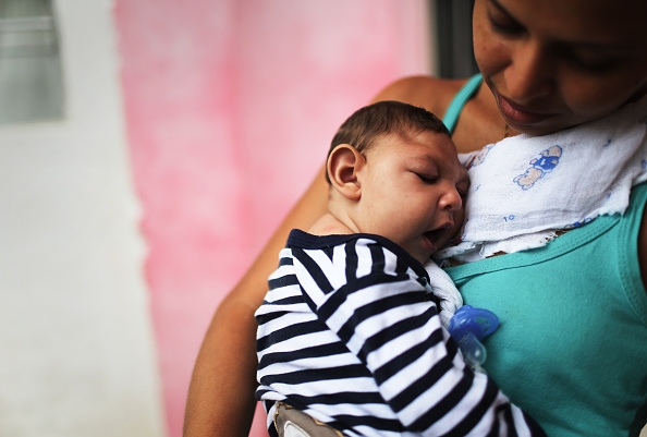 Mother Daniele Santos holds her baby Juan Pedro who has microcephaly