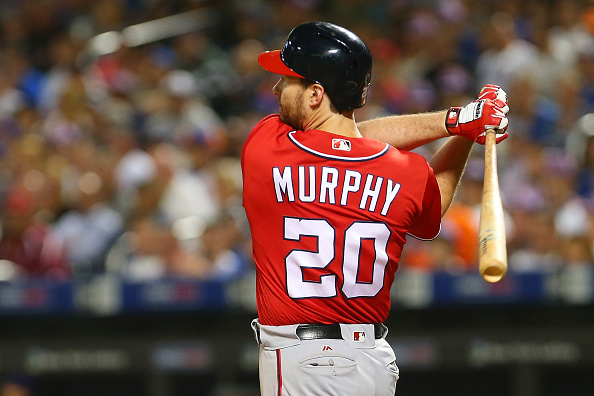 NEW YORK NEW YORK- JULY 09 Daniel Murphy #20 of the Washington Nationals follows through on a two run home run in the seventh inning against the New York Mets at Citi Field