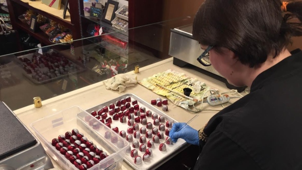 Natasha Gilmore paints Pokeballs onto truffles at the Newfoundland Chocolate Company on Duckworth Street in St. John's