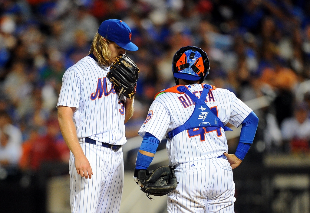 07/08/16 washington nationals vs ny mets at citifield queens ny  Washington Nationals lead 3-0 after 4 innnings  New York Mets catcher Rene Rivera #44  visits the mound to check on New York Mets starting pitcher Noah Syndergaar