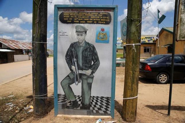 A painting depicting Isaac Adaka Boro a former Niger Delta militant in the 1960s is seen along a road in the village of Kiama near Yenagoa in Nigeria's Delta regi