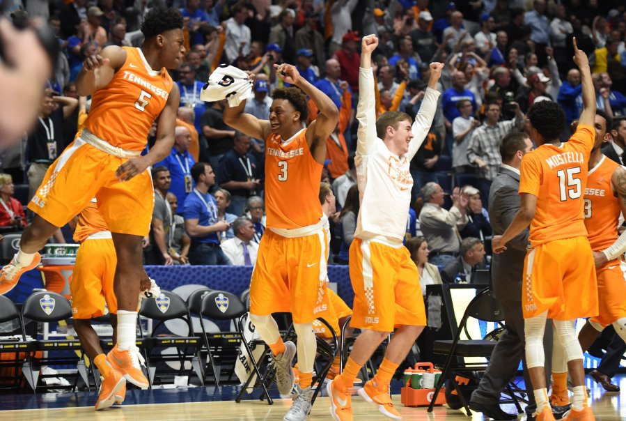 Tennessee forward Admiral Schofield, Tennessee guard Robert Hubbs III, Tennessee guard Brad Woodson, and Tennessee guard Detrick Mostella, from left celebrate after referees overturned Vanderbilt's potentially game-tying point at