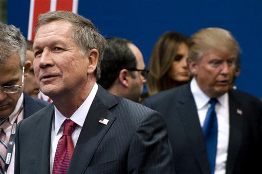 Ohio Gov. John Kasich left and Donald Trump right speak to reporters after a Republican presidential primary debate hosted by ABC News at Saint Anselm College in Manchester N.H