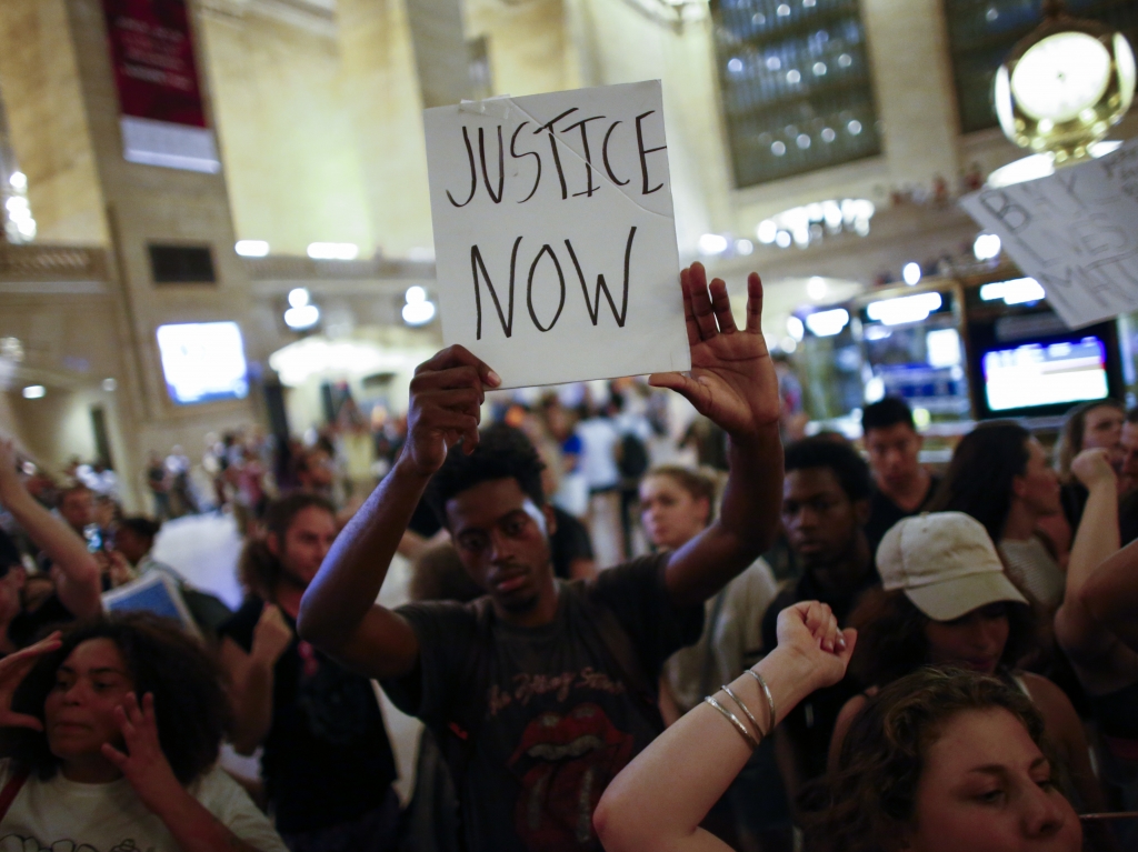 People take part in a protest in New York City's Grand Central Station on Friday.   Kena Betancur    
  Getty Images