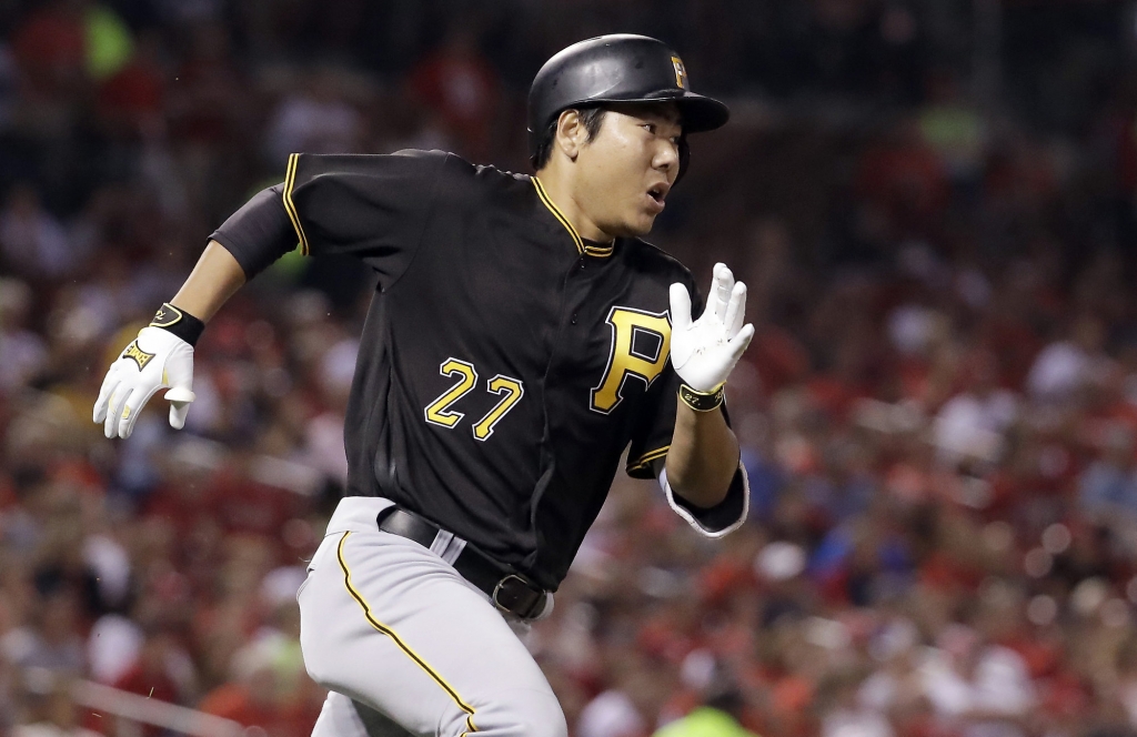 Pittsburgh Pirates&apos Jung Ho Kang rounds first after hitting a two-run double off St. Louis Cardinals relief pitcher Jonathan Broxton during the seventh inning of a baseball game Wednesday