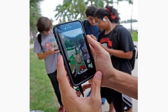 Pinsir a Pokemon is found by a group of Pokemon Go players at Bayfront Park in downtown Miami. The