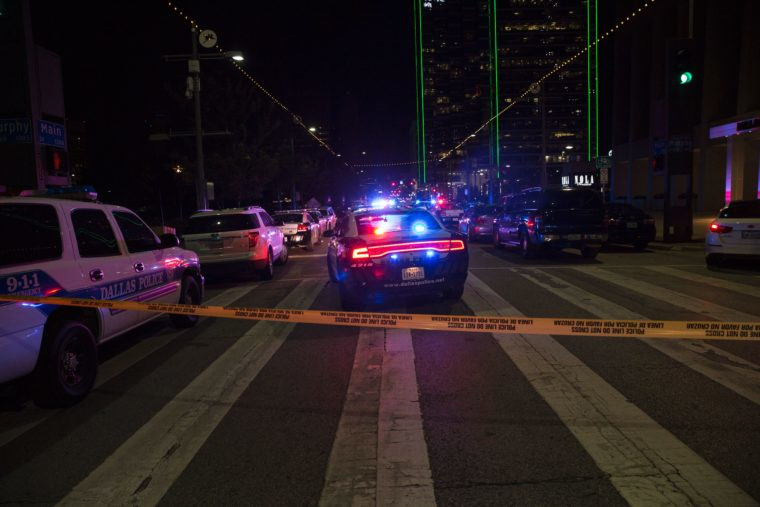 Police cars sit on Main Street in Dallas following the sniper shooting