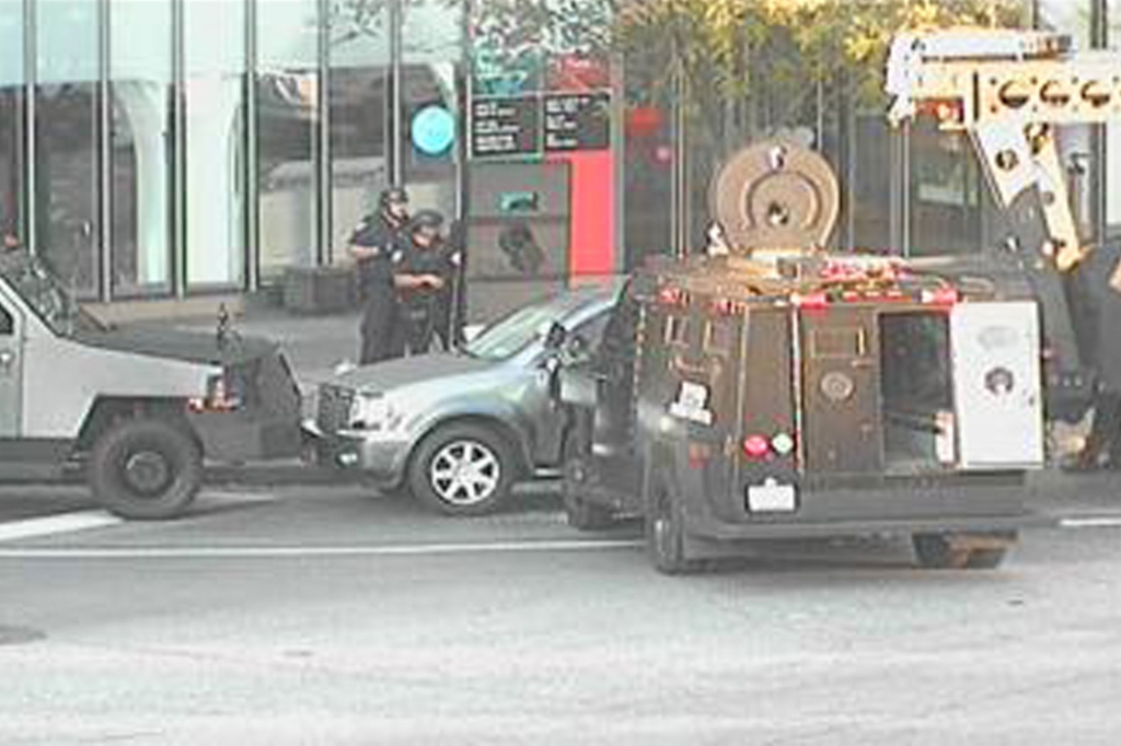 Police pin vehicles near the suspect’s car at Columbus Circle