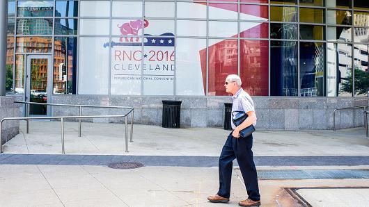 A man walks past the Quicken Loans Arena