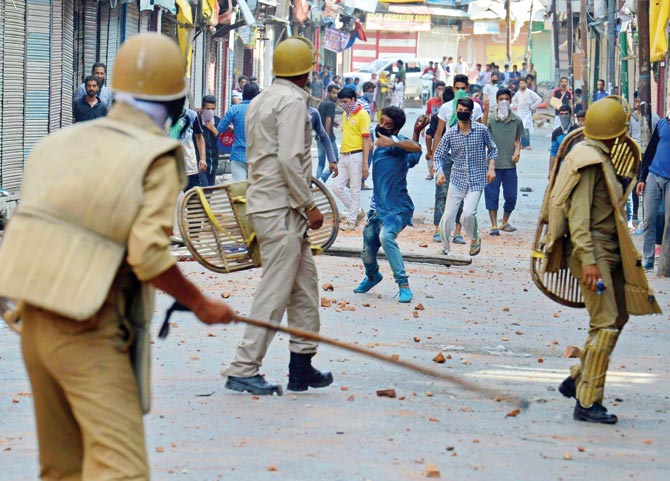 Protesters clash with security forces in downtown Srinagar yesterday. Pic  AFP