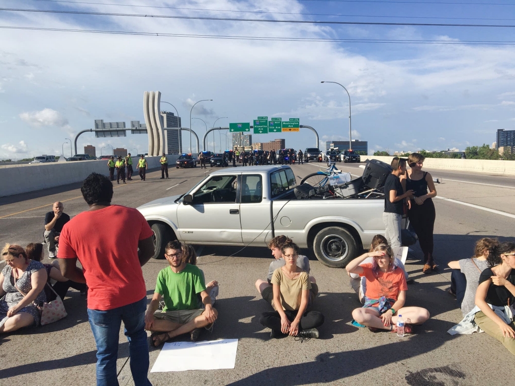 Protesters line up on I-35W