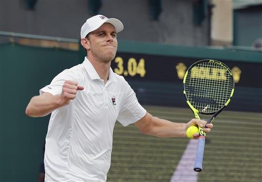 Sam Querrey of the U.S celebrates after beating Nicolas Mahut of France in their men's singles match on day eight of the Wimbledon Tennis Championships in London Monday