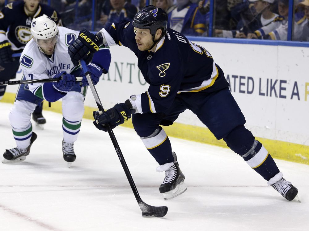 St. Louis Blues&#039 Steve Ott right controls the puck as Vancouver Canucks&#039 Linden Vey watches during the second period