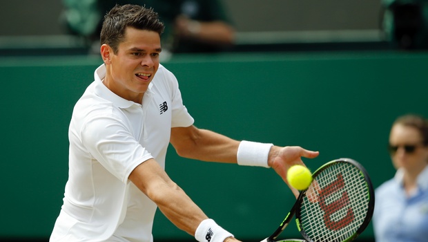 Milos Raonic of Canada returns to Sam Querrey of the U.S during their men's singles match on day ten of the Wimbledon Tennis Championships in London. |AP