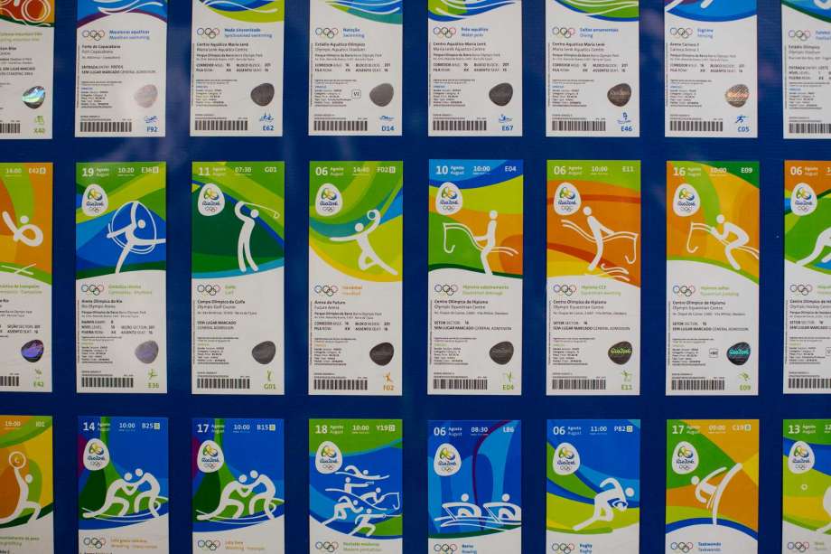 Olympic tickets are displayed during an event at the Rio 2016 headquarters in Rio de Janeiro Brazil. Non Brazilians who bought Olympic tickets early may be regretting it having paid higher prices and add-on fees. In a
