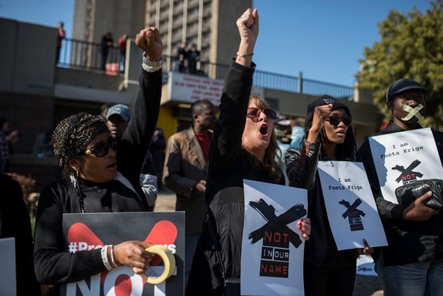 Members of the media and civil society groups protest outside the head office of the South African Broadcast Corporation against the censorship of the news by the state broadcaster. The SABC has banned footage from protests against