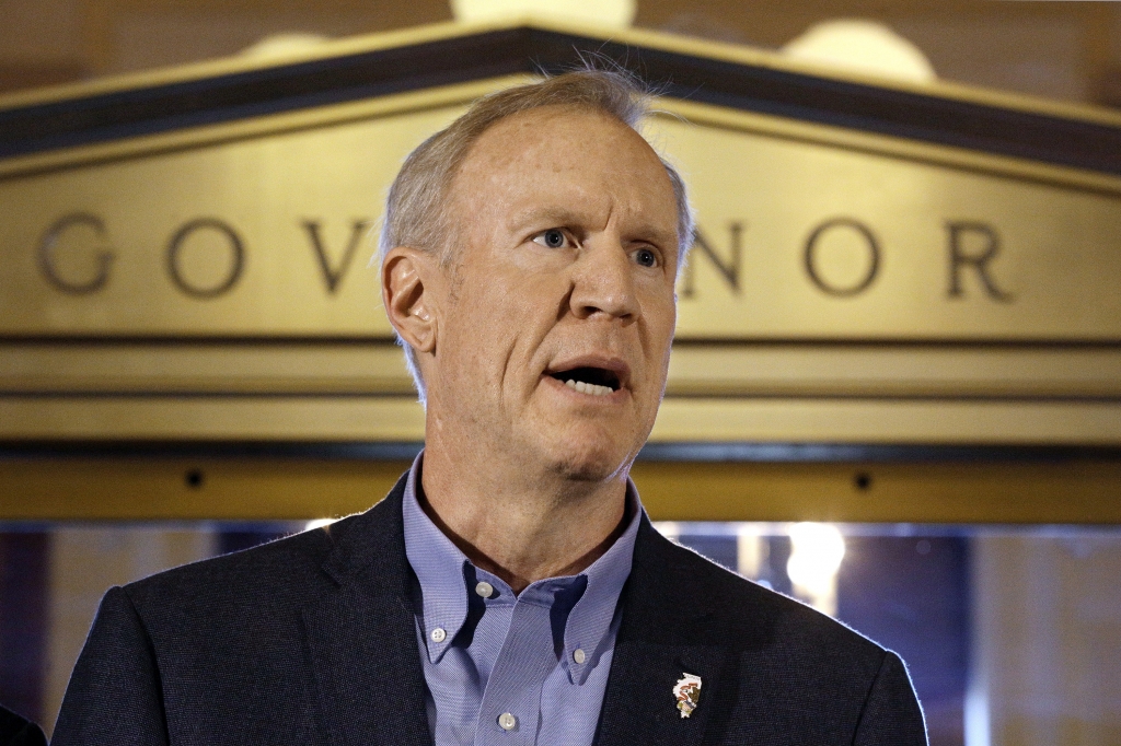 Illinois Gov. Bruce Rauner speaks to reporters in front of his office at the Illinois State Capitol Thursday