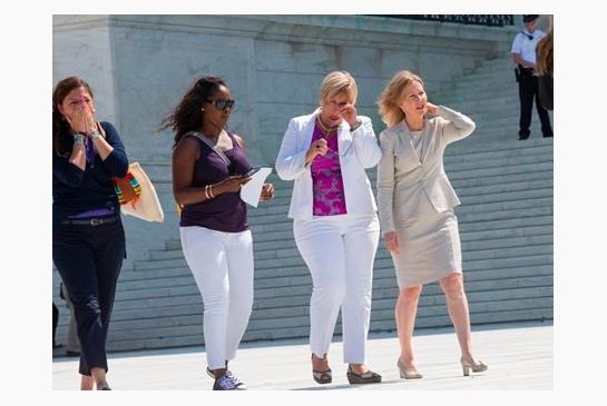 Amy Hagstrom Miller second from right founder of Whole Woman's Health a Texas women's health clinic that provides abortions leaves the Supreme Court in Washington Monday