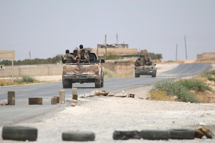 Syria Democratic Forces SDF ride vehicles along a road near Manbij in Aleppo Governorate Syria June 25 2016 REUTERS Rodi Said Files